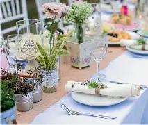  ?? 123RF.COM ?? For a backyard wedding, you can’t go wrong with a burlap table runner and plants of different kinds.