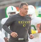  ?? DANA SPARKS, CHRIS PIETSCH/THE REGISTER-GUARD ?? Ohio State coach Ryan Day said Mario Cristobal, pictured, “brings a style of toughness to the table” at Oregon.