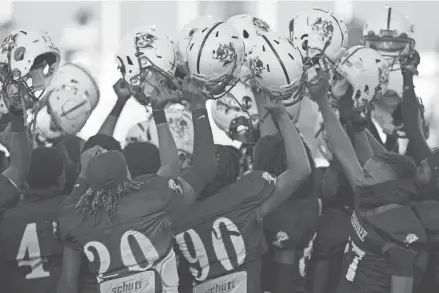  ?? ?? Pahokee players rally before the game against Glades Central. Pahokee High School in Pahokee on Nov. 3.