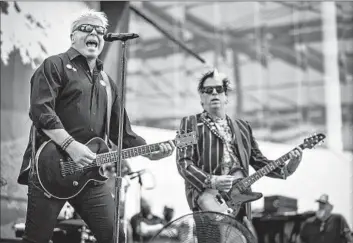  ?? Jason Armond Los Angeles Times ?? THE OFFSPRING’S Bryan “Dexter” Holland, left, and Kevin “Noodles” Wasserman at SoFi Stadium in 2021.