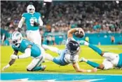  ?? REBECCA BLACKWELL AP ?? Titans quarterbac­k Will Levis lunges for the end zone in first half against the Dolphins on Monday night.