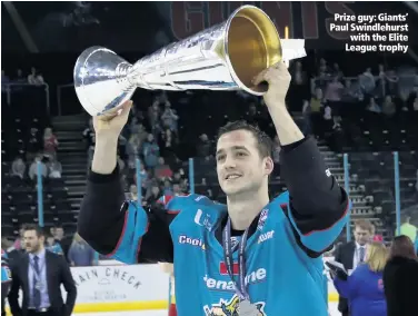  ??  ?? Prize guy: Giants’ Paul Swindlehur­st
with the Elite League trophy