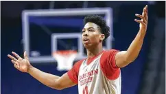  ??  ?? For UH senior Corey Davis Jr., top, the NCAA Tournament is old hat after last year’s experience. Freshman Nate Hinton, bottom, admits he’s “following their lead” in deference to his veteran teammates.