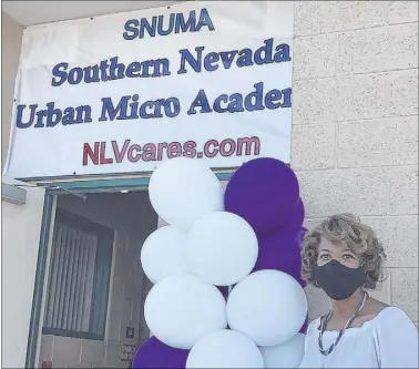 ?? Alex Chhith Las Vegas Review-Journal ?? North Las Vegas Councilwom­an Pamela Goynes-Brown poses next to the Southern Nevada Urban Micro Academy during the first day of school.
