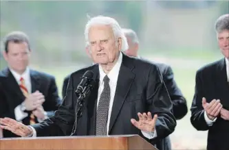  ?? GERRY BROOME THE ASSOCIATED PRESS ?? Billy Graham transforme­d American religious life through his preaching and activism.