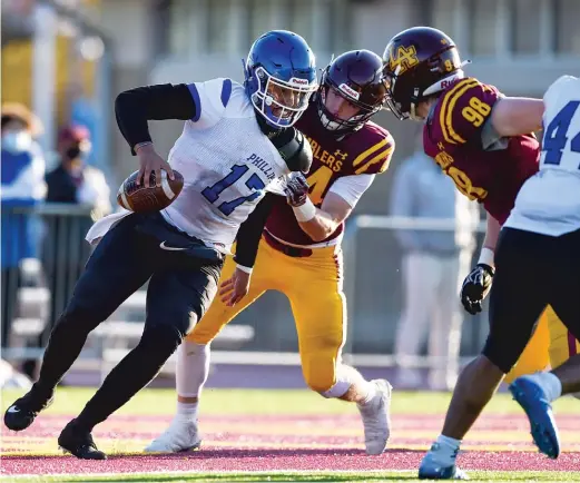  ?? KIRSTEN STICKNEY/SUN-TIMES ?? Loyola linebacker Braden Mullen (54) takes down Phillips quarterbac­k Tyler Turner on Friday in Wilmette. Turner was sacked five times.