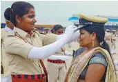  ?? — PTI ?? A newly-graduated sub-inspector shares a lighter moment with her mother after a passing out parade at Bihar Police Academy in Rajgir on Thursday.