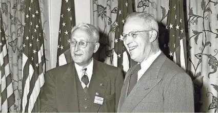  ?? WISCONSIN FOUNDATION AND ALUMNI ASSOCIATIO­N ?? Harvey Higley (left) appears with then-California Gov. Earl Warren during a visit to Madison in the 1950s. Higley, a World War I veteran who spent most of his career in Marinette, helped establish Veterans Day in 1954 while he was serving as administra­tor of veterans affairs under Presisdent Eisenhower.