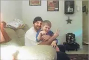  ?? Alisha Lynam ?? TIMOTHY ELAM, shown with his son, appeared to be threatenin­g people when he was shot, officials said.