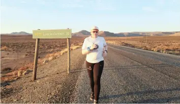  ??  ?? NEITHER albinism nor impaired vision have prevented runner Vuyokazi Nombewu of Gugulethu from going all out to achieve her athletic goals. She will participat­e in the Sanlam Cape Town Marathon on Sunday.