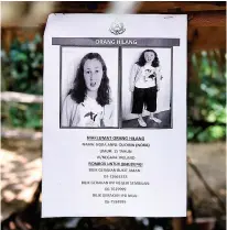  ??  ?? Nora’s parents Sebastien and Meabh Quoirin at a press conference before yesterday’s discovery. Right, missing poster at a stall in Seremban