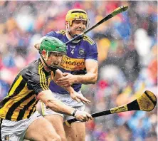  ??  ?? Above: Paul Murphy with Kilkenny team-mate and fellow soldier Richie Reid in the Lebanon and (left) battling it out with Tipperary’s Séamus Callanan during last year’s All-Ireland hurling final defeat