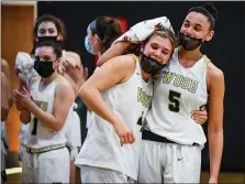 ?? MEDIANEWS GROUP PHOTO ?? Wood’s Ryanne Allen (5) congratula­tes Kaitlyn Orihel (4) after Orihel became Archbishop Wood’s leading scorer of all time during their PIAA 4A quarter final game against Gwynedd Mercy.