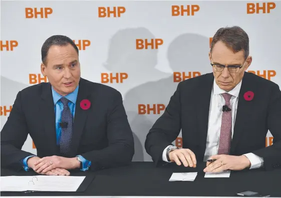  ??  ?? Chairman of BHP Ken MacKenzie and CEO Andrew Mackenzie after the BHP AGM in Adelaide