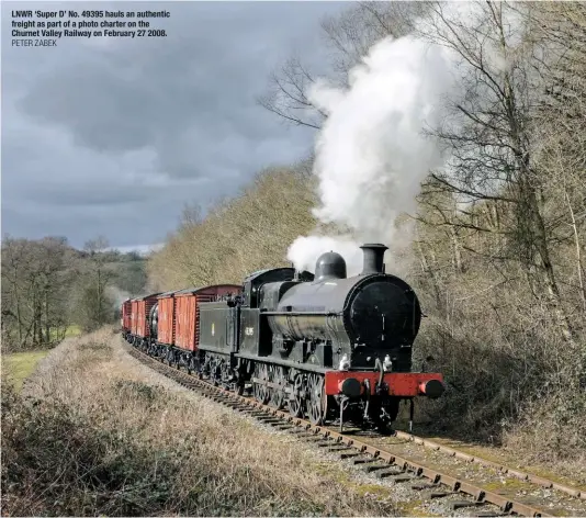  ?? PETER ZABEK ?? LNWR ‘Super D’ No. 49395 hauls an authentic freight as part of a photo charter on the Churnet Valley Railway on February 27 2008.