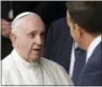  ?? MATT DUNHAM — THE ASSOCIATED PRESS ?? Pope Francis meets with Irish Prime Minister Leo Varadkar, right, as he arrives at Dublin Castle, Ireland, Saturday.