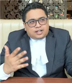  ??  ?? Muhammad Hafiz reacts during his interview with Bernama reporter. — Bernama photo