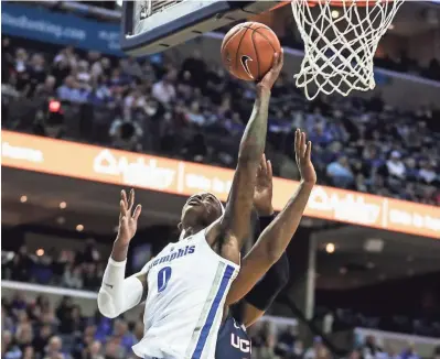  ??  ?? Memphis’ Kyvon Davenport goes up for a shot Sunday. BRAD VEST/THE COMMERCIAL APPEAL