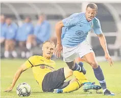  ??  ?? Borussia Dortmund’s Sebastian Rode vies for the ball with Manchester City’s Lukas Nmecha (right) during the 2018 Internatio­nal Champions Cup at Soldier Field in Chicago in this file photo. — AFP photo