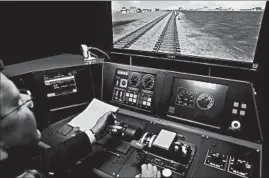  ?? AP/FILE ?? Federal investigat­ors have listed a lack of technology called positive train control, demonstrat­ed above, as a contributi­ng factor in at least 25 crashes over the last 20 years.