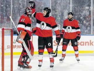 ??  ?? Senators defenceman Cody Ceci congratula­tes goalie Craig Anderson after defeating the Canadiens on Saturday. Anderson finally climbed back over the .900 hump in save percentage.