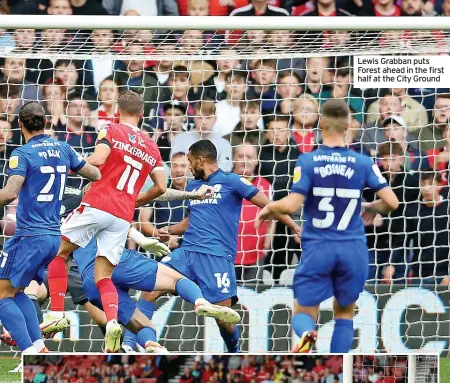  ??  ?? Lewis Grabban puts Forest ahead in the first half at the City Ground