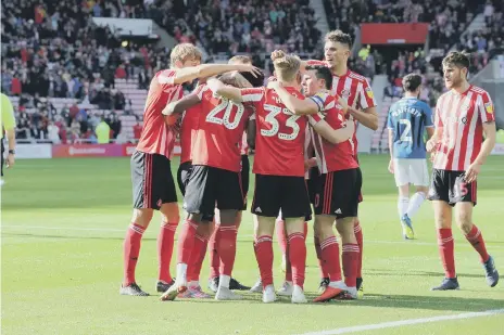  ??  ?? Sunderland celebrate on their way to a 4-1 win over Rochdale.