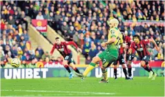  ??  ?? Decisive moment: Norwich striker Teemu Pukki fires home after Steve Cook’s dismissal
