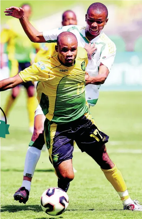  ??  ?? Jamaica’s Jermaine Hue breaks away from South Africa’s Nkosi during the second half of their CONCACAF Gold Cup match in 2005. Hue scored Jamaica’s opening goal in a 3-3 draw.