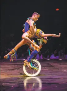  ?? Matt Beard / Cirque du Soleil ?? Acrobats ride a unicycle in Cirque du Soleil’s “Volta,” which is being performed at AT&amp;T Park through Feb. 3.