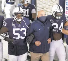  ?? BARRYREEGE­R/AP ?? Penn State head coach James Franklin leads his team onto the field for a game against Illinois on Saturday in State College.