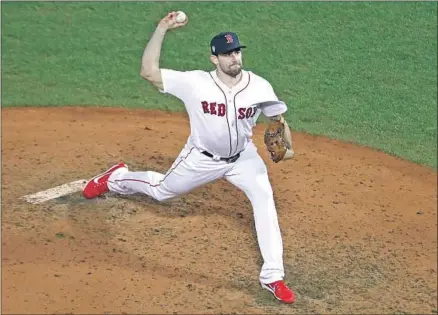  ?? Al Bello Getty Images ?? NATHAN EOVALDI delivers a pitch for the Boston Red Sox during the eighth inning of Game 2 against the Dodgers.