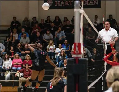  ?? Cory Pitkavish/For The Signal (See additional photos at signalscv.com) ?? Hart’s Ashley Cosey (11) jumps up for a kill in a game against Woodrow Wilson of Long Beach on Tuesday at Hart.