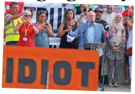  ??  ?? Sign of the times: Mr Corbyn…photobombe­d by a placard