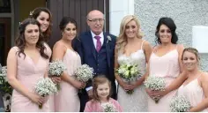  ??  ?? ALL-STAR WEDDING: Fiona Hudson arriving for her wedding and to GAA star Paul Flynn (right).