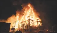  ?? Mark Vancleave / Minneapoli­s Star Tribune / TNS ?? An affordable housing complex under constructi­on burns after being set fire during protests in Minneapoli­s on Wednesday.