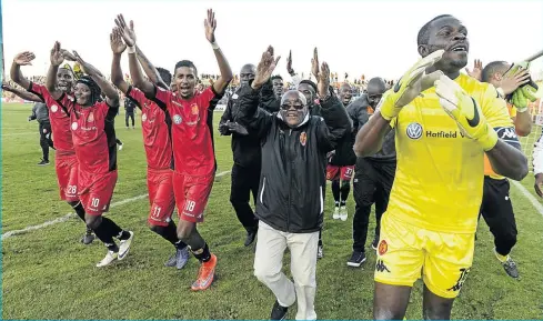  ?? PHOTO: SYDNEY SESHIBEDI/GALLO IMAGES ?? WE DID IT: Highlands Park players and officials celebrate after their 2-0 victory over Mbombela United at Makhulong Stadium on Wednesday. The winshot the Tembisa-based outfit into the Absa Premiershi­p