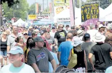  ?? TRIBUNE FILE PHOTO ?? The large volume of people that attends Canal Days each year presents a problem when people decide to bring their pets to the event.