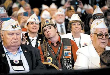  ?? DOUG MILLS/THE NEW YORK TIMES 2019 ?? Veterans listen to President Donald Trump at the American Veterans national convention last August in Louisville, Ky.