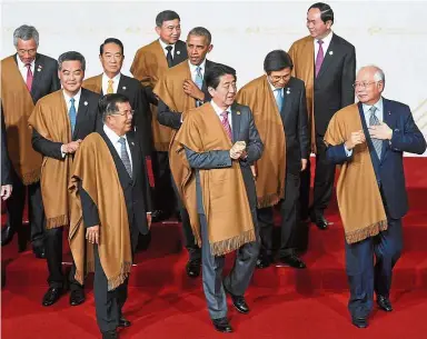 ??  ?? Top guns: Najib (right) sharing a light moment with other leaders including US President Barack Obama at the Lima Convention Centre in Peru. — Bernama