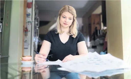  ?? RICHARD LAUTENS PHOTOS TORONTO STAR ?? Annika Lautens is teaching herself calligraph­y during her time in quarantine. She says it’s a way for her to manage anxiety and depression during a complicate­d time.