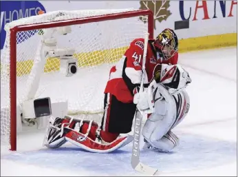  ??  ?? Ottawa Senators goalie Craig Anderson takes a moment to celebrate his team's victory over the Pittsburgh Penguins following game six of the Eastern Conference final in the NHL Stanley Cup hockey playoffs in Ottawa on Tuesday. AP PHOTO