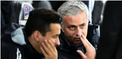  ??  ?? Jose Mourinho chats with assistant Rui Faria during Manchester United’s League Cup victory over Swansea