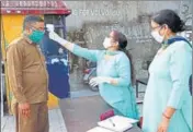  ?? BIRBAL SHARMA/HT ?? A Himachal Road Transport Corporatio­n employee undergoes a health check before resuming duty in Mandi.