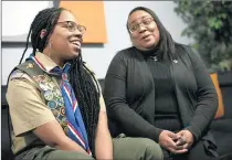  ?? E. JASON WAMBSGANS/CHICAGO TRIBUNE ?? Kendall Jackson, 17, of Scherervil­le, shares a moment with her mother, Kellauna Mack, on Thursday. Jackson is one of 21 Black girls and women to earn the rank of Eagle Scout.