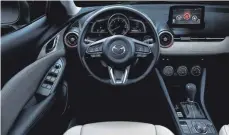  ??  ?? Übersichtl­ich ist das Cockpit des CX-3 gestaltet.