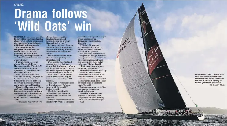  ?? PHOTO: GETTY IMAGES ?? Wind in their sails . . . Super Maxi Wild Oats sails up the Derwent River moments before taking line honours in the 2018 Sydney to Hobart yacht race yesterday.