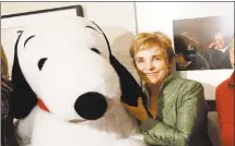 ?? JACQUELYN MARTIN — ASSOCIATED PRESS ?? “Peanuts” creator Charles M. Schulz’s widow, Jean Schulz, standswith a plush Snoopy in 2010. The home of Charles Schulz burned to the ground in the wildfires but his widowescap­ed, her stepson saidWednes­day.