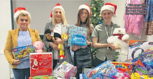  ??  ?? The merseyflow team celebratin­g the best year yet for toy donations