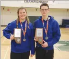  ?? Photo submitted by Jody Evanson ?? Maren Evanson and Justin Bly show their silver medals and hold the team awards for second place.